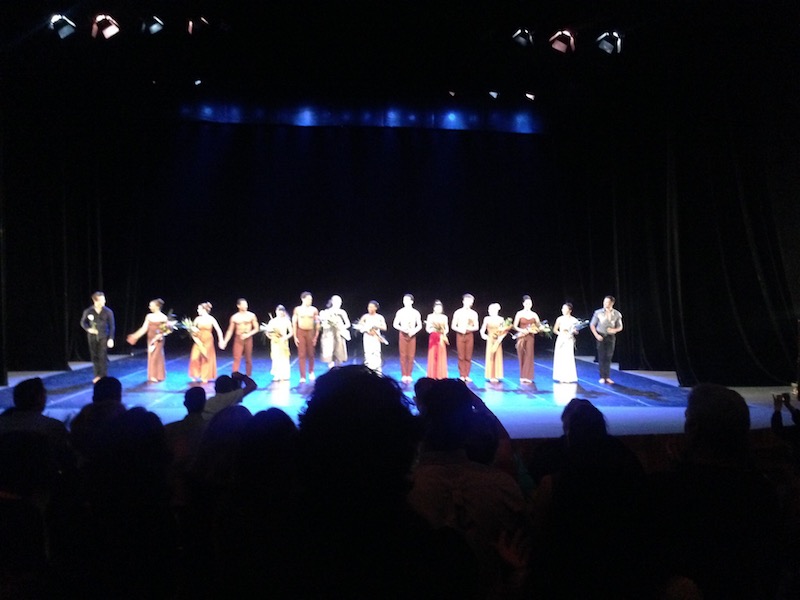 Graham Dancers hold flowers and bow on the stage of Teatro Mello